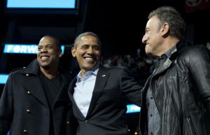 President Barack Obama is flanked on stage by musicians Jay-Z, left, and Bruce Springsteen at a campaign event at Nationwide Arena, Monday, Nov. 5, 2012